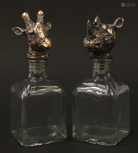 Pair of glass decanters with rhinoceros and giraffe