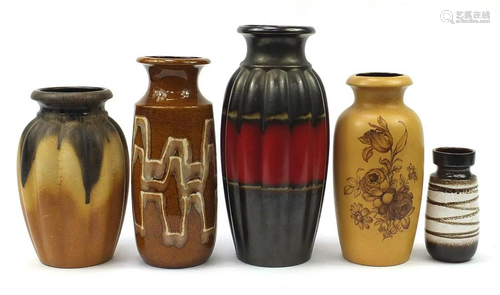 Five West German pottery vases, one with flowers, the