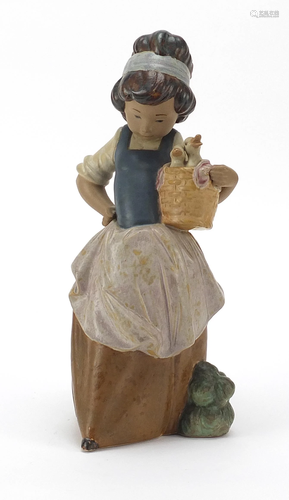 Lladro pottery model of a young girl carrying a basket,