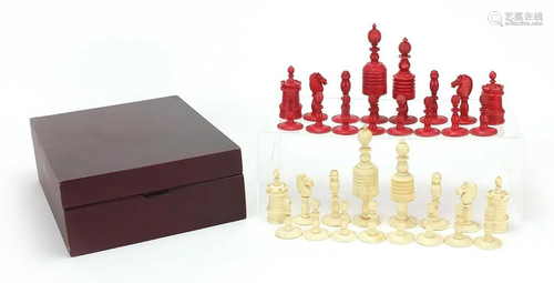 Half stained carved bone chess set, the largest pieces