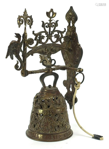 Bronzed swinging arm doorbell with a griffin and a cord