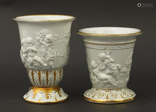 Two Italian hand gilded porcelain vases relief