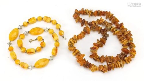 Two Baltic amber coloured necklaces, the largest 68cm