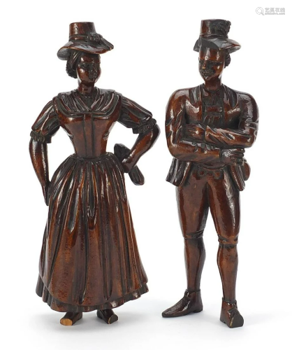 Pair of antique continental wood carvings of peasants
