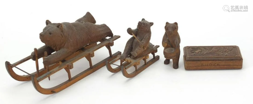Three carved Black Forest bears and a matchbox