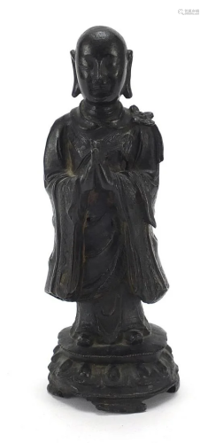 Chinese patinated bronze figure of a standing monk,