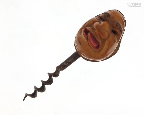 Coquilla nut corkscrew carved with a face, 11cm in