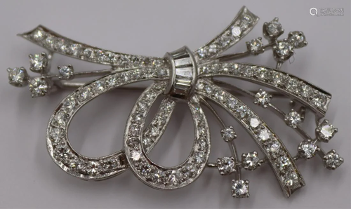 JEWELRY. Platinum and Diamond Floral Spray Brooch.