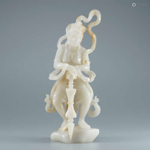 A Carved White Jade Figure Of Acala