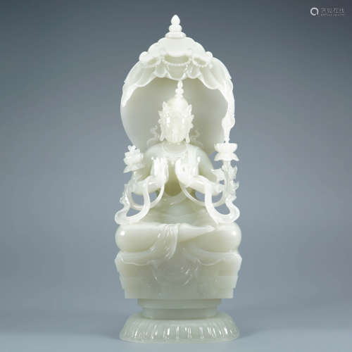 A Carved White Jade Buddha