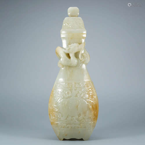 A Carved Russet And White Jade Dragon Vase