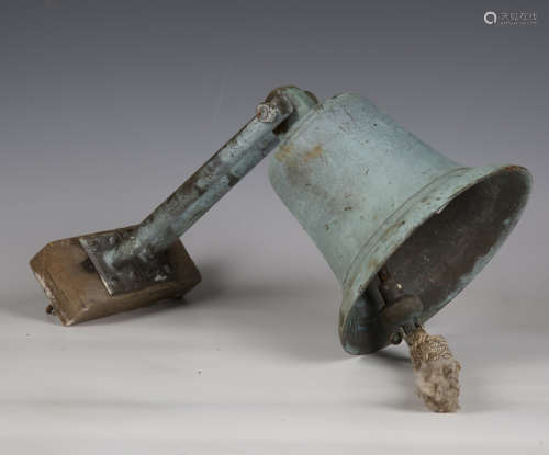 An early 20th century verdigris bronze ship's bell with rope...
