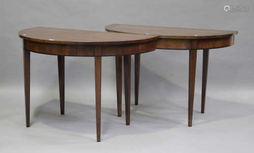 A pair of 19th century mahogany 'D'-end console tables, rais...