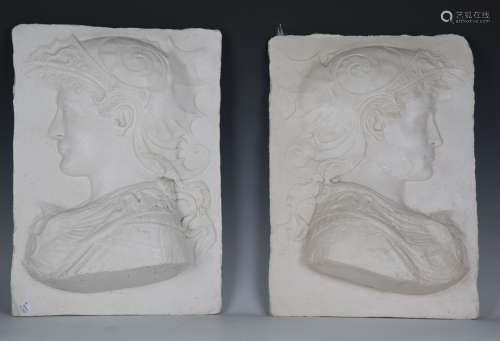 A pair of 20th century cast plaster panels depicting classic...