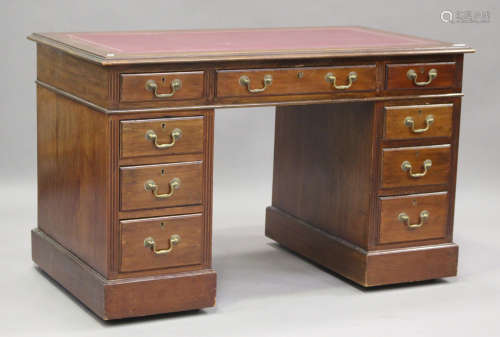 A Victorian mahogany twin pedestal desk, fitted with nine dr...