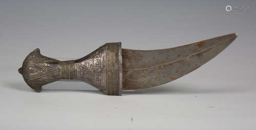 An early 20th century Arabian silver mounted jambia with cur...