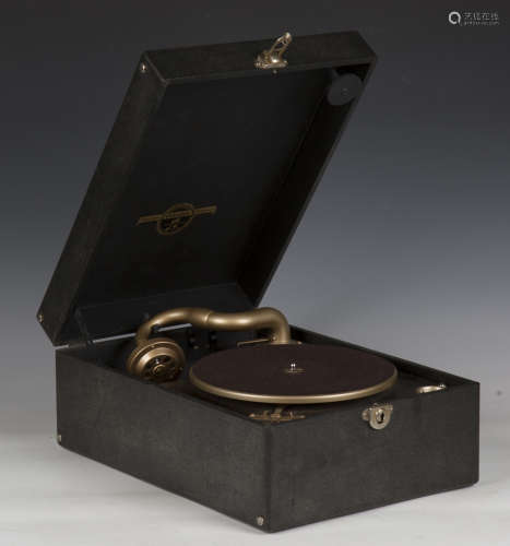 A Columbia mechanical portable gramophone with a black leath...