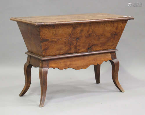 A 19th century Continental elm and fruitwood dough bin, the ...