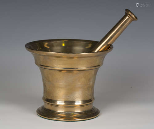 An 18th century bell metal pestle and mortar, length of pest...