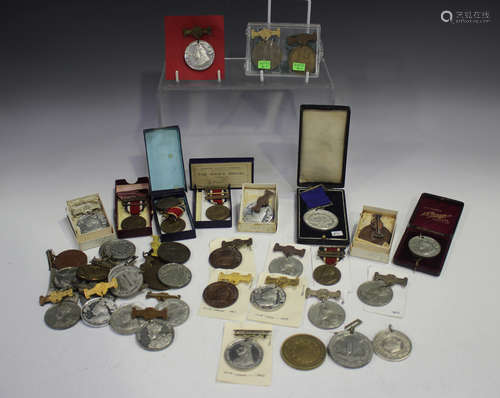 A collection of school attendance medals, mostly London Coun...