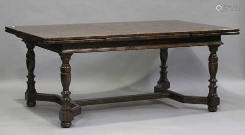 A 20th century oak draw-leaf dining table with parquetry top...