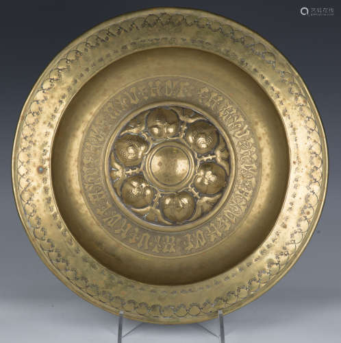An 18th/19th Nuremberg brass circular charger with embossed ...