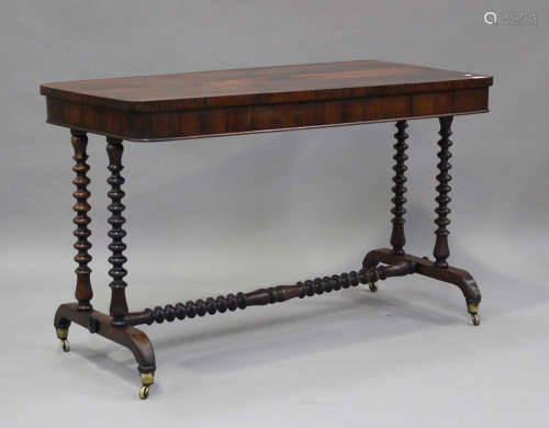 An early Victorian rosewood centre table, raised on barley t...