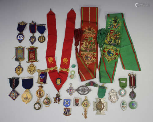 A collection of medals, badges and fobs, including many enam...