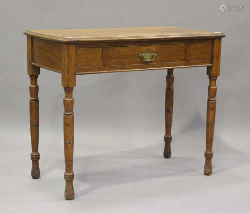 A late Victorian oak side table, fitted with a single drawer...