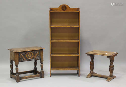 A 20th century oak box seat stool with carved decoration, he...