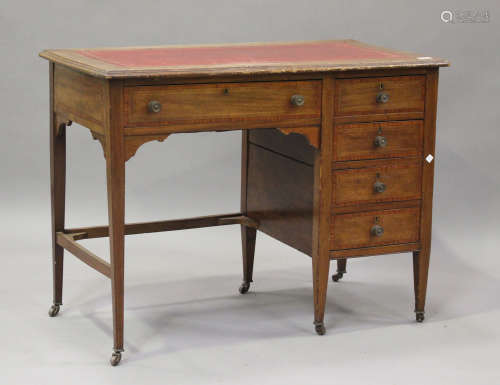 An Edwardian mahogany single pedestal desk, fitted with five...