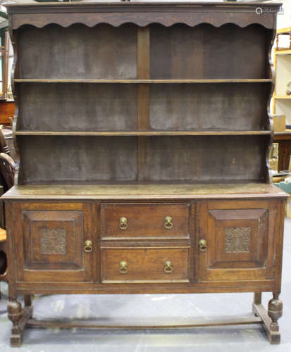 A Victorian oak dresser, the shelf back above two drawers fl...