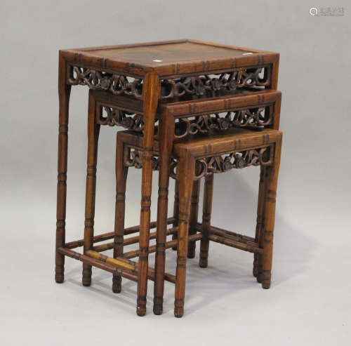 A 20th century Chinese hardwood nest of occasional tables, h...