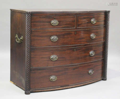 A late George III mahogany bowfront chest, the two short and...