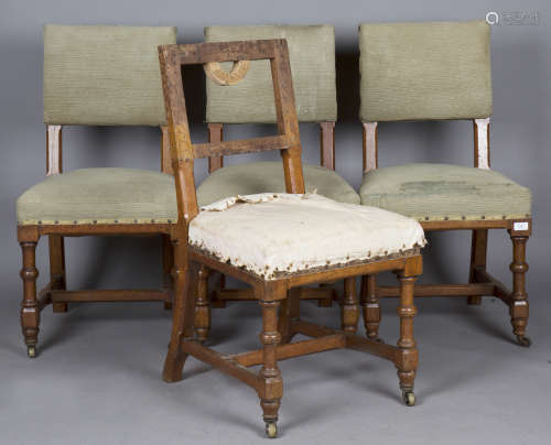 A set of four Victorian Gothic Revival oak framed chairs, in...
