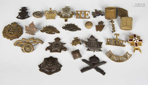 A small collection of early 20th century military cap badges...