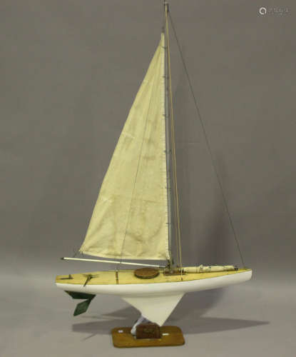An early/mid-20th century painted pond yacht with cloth sail...