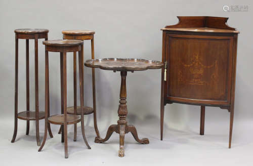 A 20th century George III style mahogany piecrust wine table...