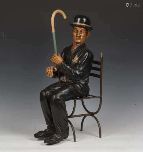 A mid/late 20th century cast painted resin model of Charlie ...