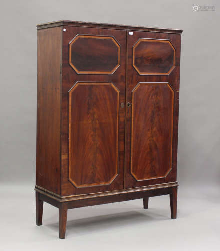 A 19th century figured mahogany cabinet, crossbanded in sati...