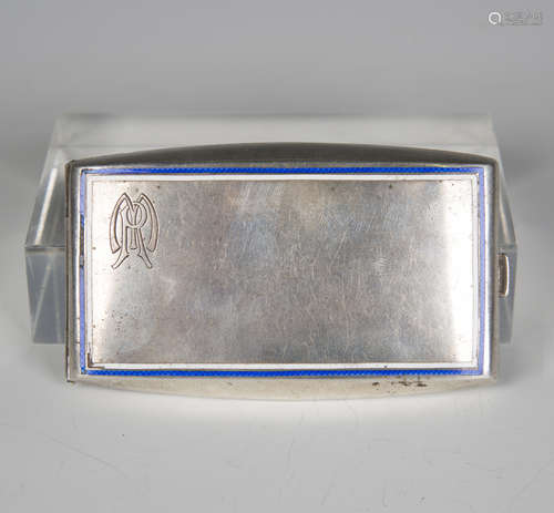 A .900 silver and enamelled curved rectangular cigarette cas...