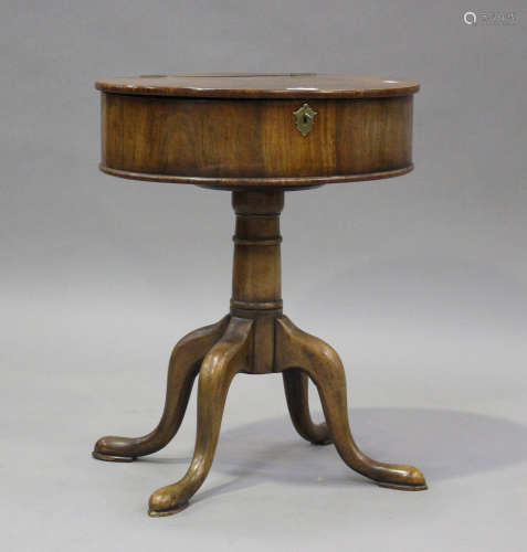 An early 20th century walnut oval drum-top work table, on ca...