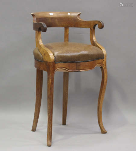 A late 20th century French walnut bar chair with brown leath...