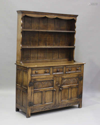 A 20th century Jacobean style oak dresser, the shelf back ab...