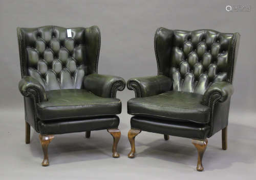A pair of 20th century George III style wingback armchairs, ...