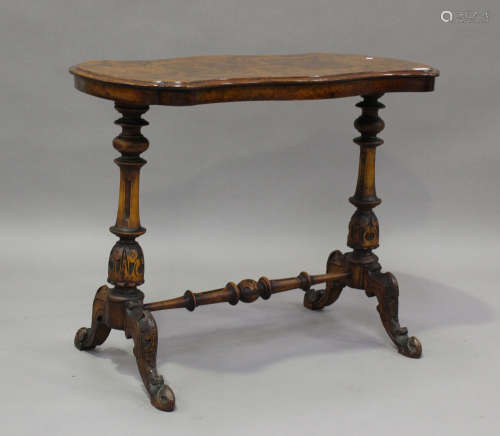 A mid Victorian burr walnut centre table, the shaped top rai...