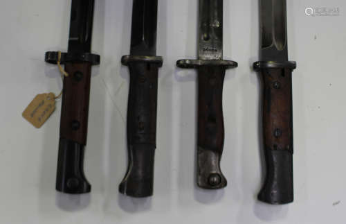 A group of four K98 Mauser bayonets, including a Siamese iss...