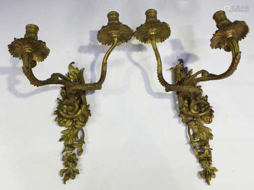 A pair of late 19th/early 20th century cast gilt metal two-b...