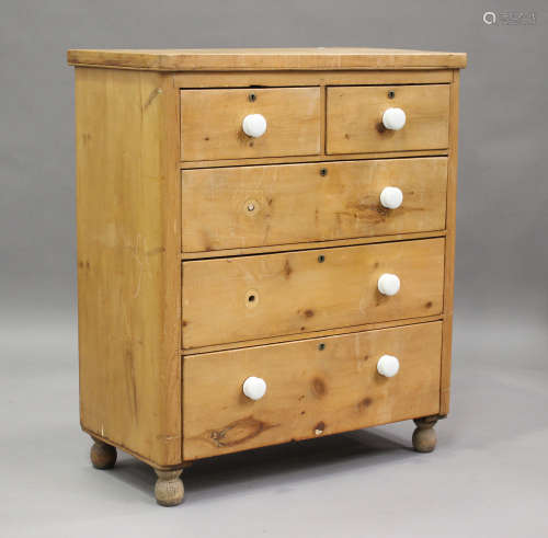 A Victorian pine chest of two short and three long drawers w...