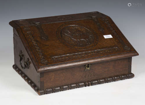 An 18th century and later bible box with carved decoration, ...